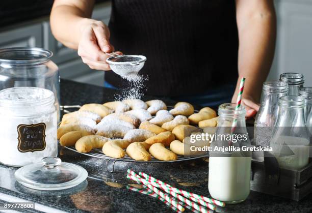 making a traditional christmas cookies "vanilla crescents" - shortbread stock-fotos und bilder