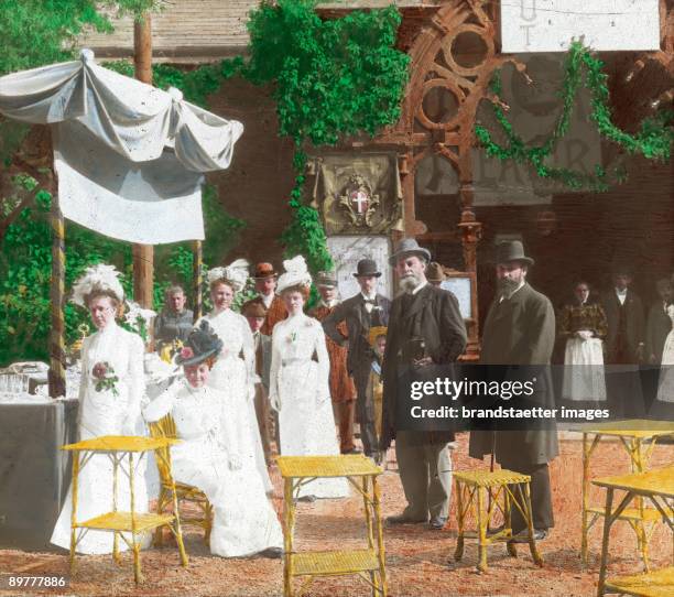 Some guests and the Viennese mayor Karl Lueger at a festivity of the education association Urania. Vienna. Hand-colored lantern slide. 1907.