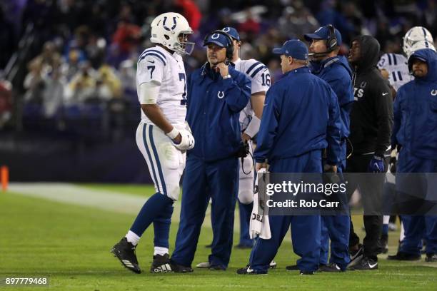 Quarterback Jacoby Brissett and head coach Chuck Pagano of the Indianapolis Colts talk on the sidelines in the fourth quarter against the Baltimore...