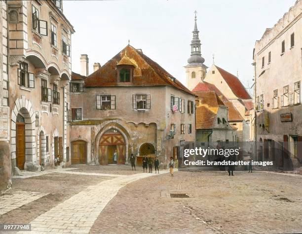 Square in Krems, in the background the parish church St. Veit. Wachau. Lower Austria. Hand-colored lantern slide. Around 1910.