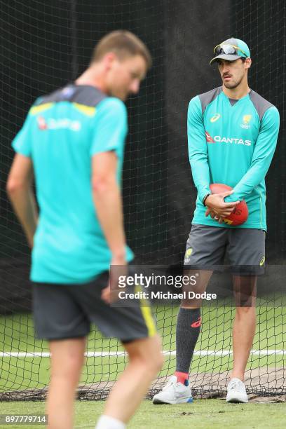 Mitchell Starc ruled out with injury looks on as possible replacement Jackson Bird walk across during an Australian nets session at the on December...