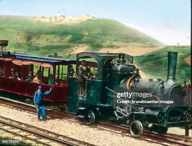 The cog railroad at the Kahlenberg was finalized in 1874 and shut down in 1921. Vienna, 19th district. Hand-colored lantern slide. Around 1910.