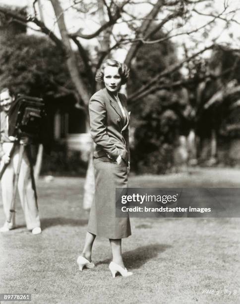 Marlene Dietrich in the garden of her Beverly Hills' domicile. Los Angeles. Photograph. Around 1935.
