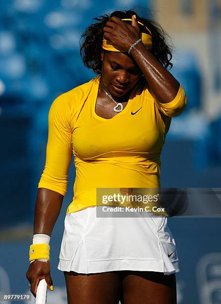 Serena Williams reacts after losing a point to Sybille Bammer of Austria during Day 4 of the Western & Southern Financial Group Women's Open on...