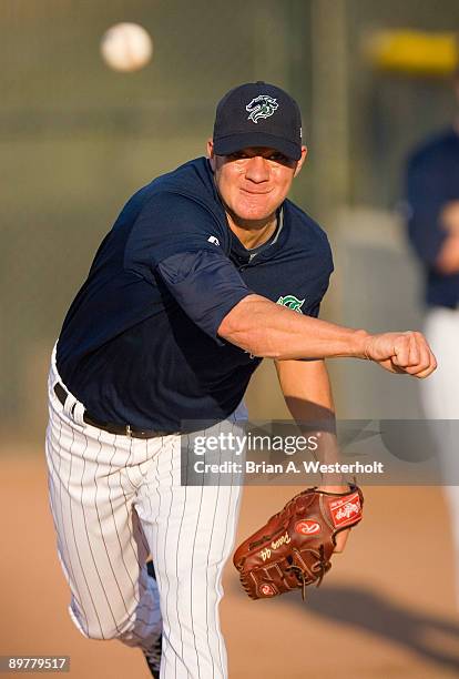 Jake Peavy of the Charlotte Knights warms up in the bullpen prior to pitching in a rehab start against the Pawtucket Red Sox at Knights Stadium on...