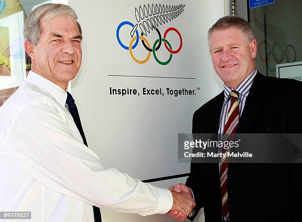 Of the New Zealand Rugby Union Steve Tew shakes hands with Secretary General of the New Zealand Olympic Committee Barry Maister after a press...