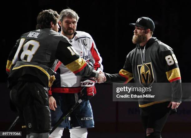 James Neal of the Vegas Golden Knights and Alex Ovechkin of the Washington Capitals shake hands with Washington Nationals outfielder Bryce Harper...