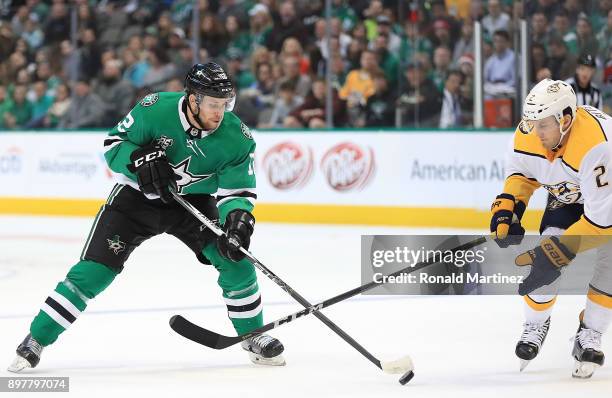 Radek Faksa of the Dallas Stars skates the puck against Anthony Bitetto of the Nashville Predators in the first period at American Airlines Center on...