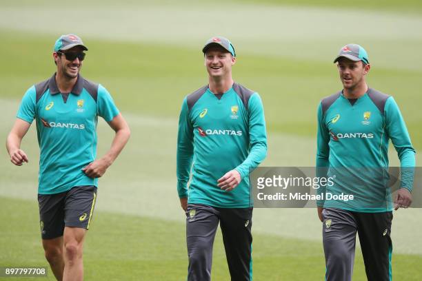 Jackson Bird walks off with Pat Cummins and Josh Hazlewood during an Australian nets session at the Melbourne Cricket Ground on December 24, 2017 in...
