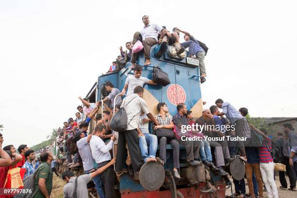 Failed to get place inside the train people are climbed on the roof and out side of the train during the time of Eid-ul Adha one of the biggest...