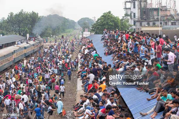 Failed to get place inside the train people are climbed on the roof and out side of the train during the time of Eid-ul Adha one of the biggest...