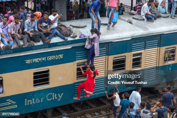 Failed to get place inside the train people are climbed on the roof and out side of the train during the time of Eid-ul Adha one of the biggest...