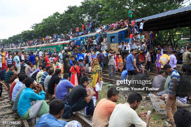 Failed to get place inside the train people are climbed on the roof and out side of the train during the time of Eid-ul Adha one of the biggest...