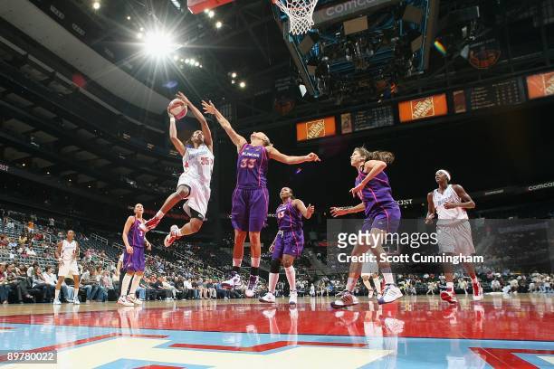 Angel McCoughtry of the Atlanta Dream puts up a shot against Kelly Mazzante of the Phoenix Mercury during the WNBA game on July 30, 2009 at Philips...