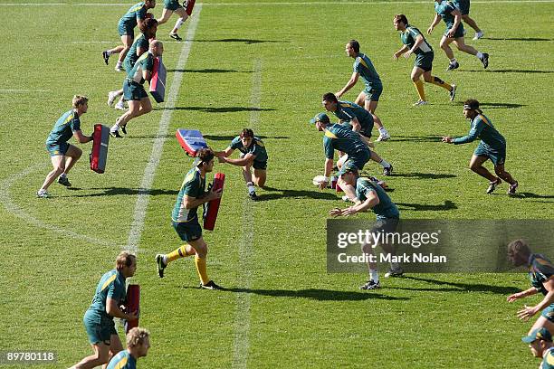 Wallabies players run through defensive drills during an Australian Wallabies training session at Leichhardt Oval on August 14, 2009 in Sydney,...