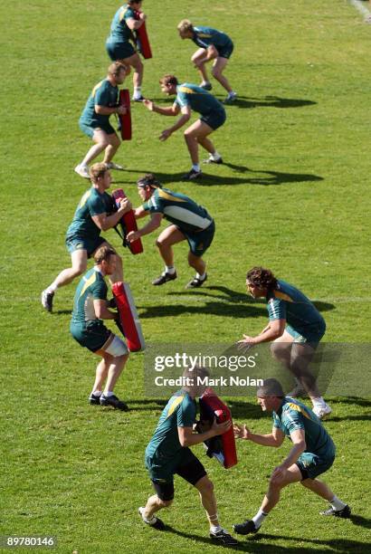 Wallabies players run through defensive drills during an Australian Wallabies training session at Leichhardt Oval on August 14, 2009 in Sydney,...