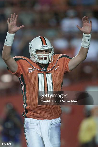 Quarterback Ken Dorsey of the Miami Hurricanes celebrates a touchdown against the Washington Huskies during the game at the Orange Bowl in Miami,...