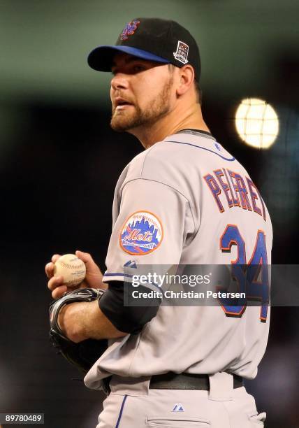 Starting pitcher Mike Pelfrey of the New York Mets stands on the mound during the major league baseball game against the Arizona Diamondbacks at...