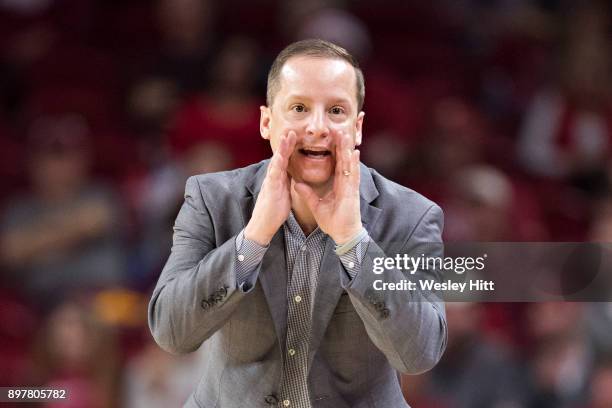 Head Coach Paul Mills of the Oral Roberts Golden Eagles yells to the officials during a game against the Arkansas Razorbacks at Bud Walton Arena on...