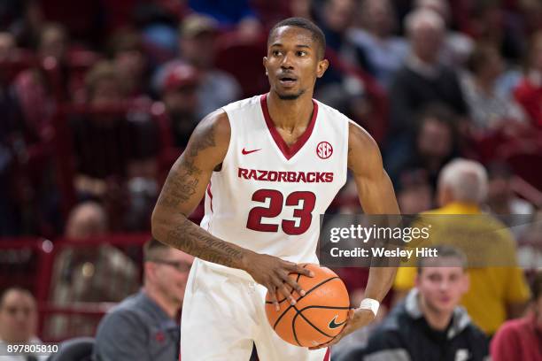Jones of the Arkansas Razorbacks looks to make a pass during a game against the Oral Roberts Golden Eagles at Bud Walton Arena on December 19, 2017...