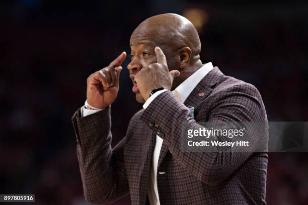 Head Coach Mike Anderson of the Arkansas Razorbacks signals to a player during a game against the Oral Roberts Golden Eagles at Bud Walton Arena on...
