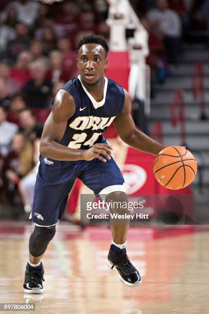 Fuqua of the Oral Roberts Golden Eagles drives down the court during a game against the Arkansas Razorbacks at Bud Walton Arena on December 19, 2017...