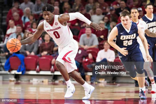 Jaylen Barford of the Arkansas Razorbacks dribbles down the court during a game against the Oral Roberts Golden Eagles at Bud Walton Arena on...