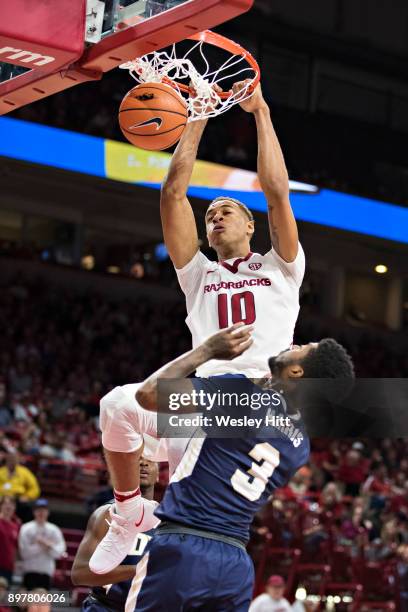 Daniel Gafford of the Arkansas Razorbacks dunks the ball during a game against the Oral Roberts Golden Eagles at Bud Walton Arena on December 19,...