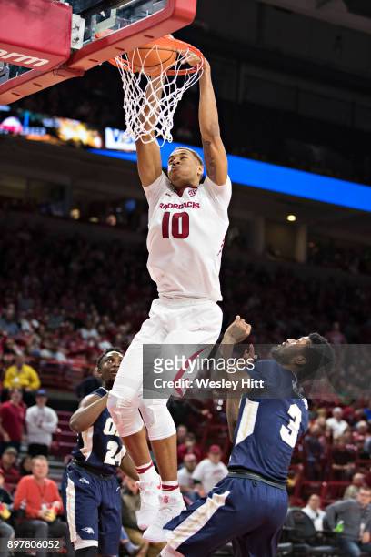 Daniel Gafford of the Arkansas Razorbacks dunks the ball during a game against the Oral Roberts Golden Eagles at Bud Walton Arena on December 19,...