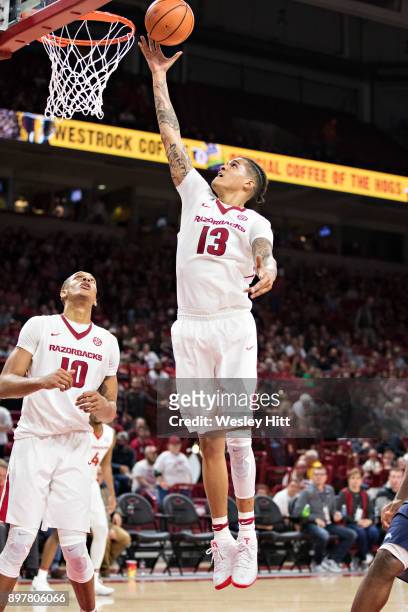 Dustin Thomas of the Arkansas Razorbacks goes up for a shot during a game against the Oral Roberts Golden Eagles at Bud Walton Arena on December 19,...