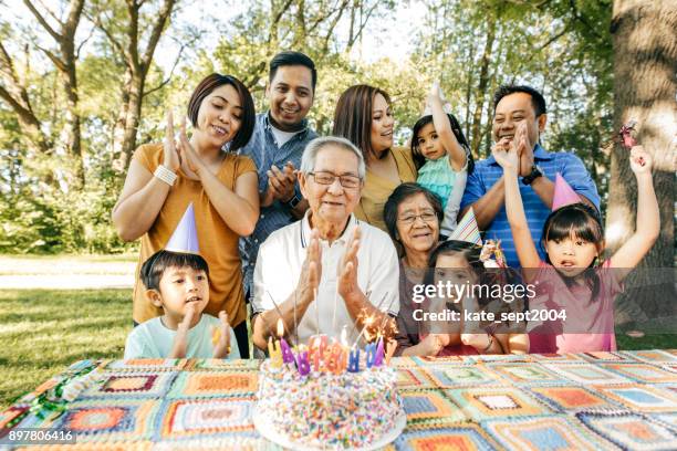 celebrating birthday with family - filipino family stock pictures, royalty-free photos & images