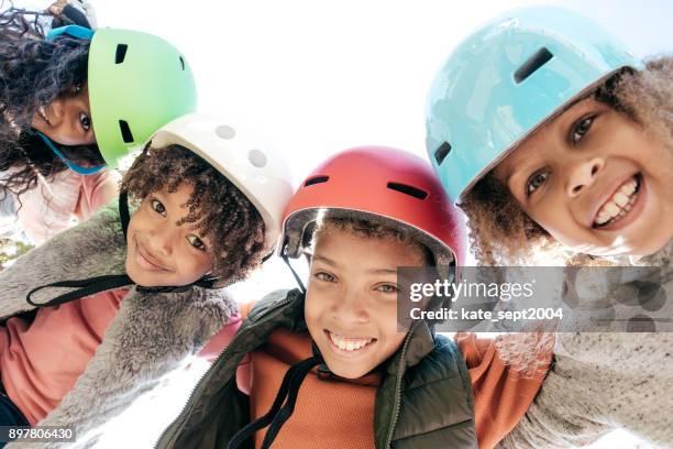 10-12 years old siblings with helmets having fun outdoor - teenager cycling helmet stock pictures, royalty-free photos & images