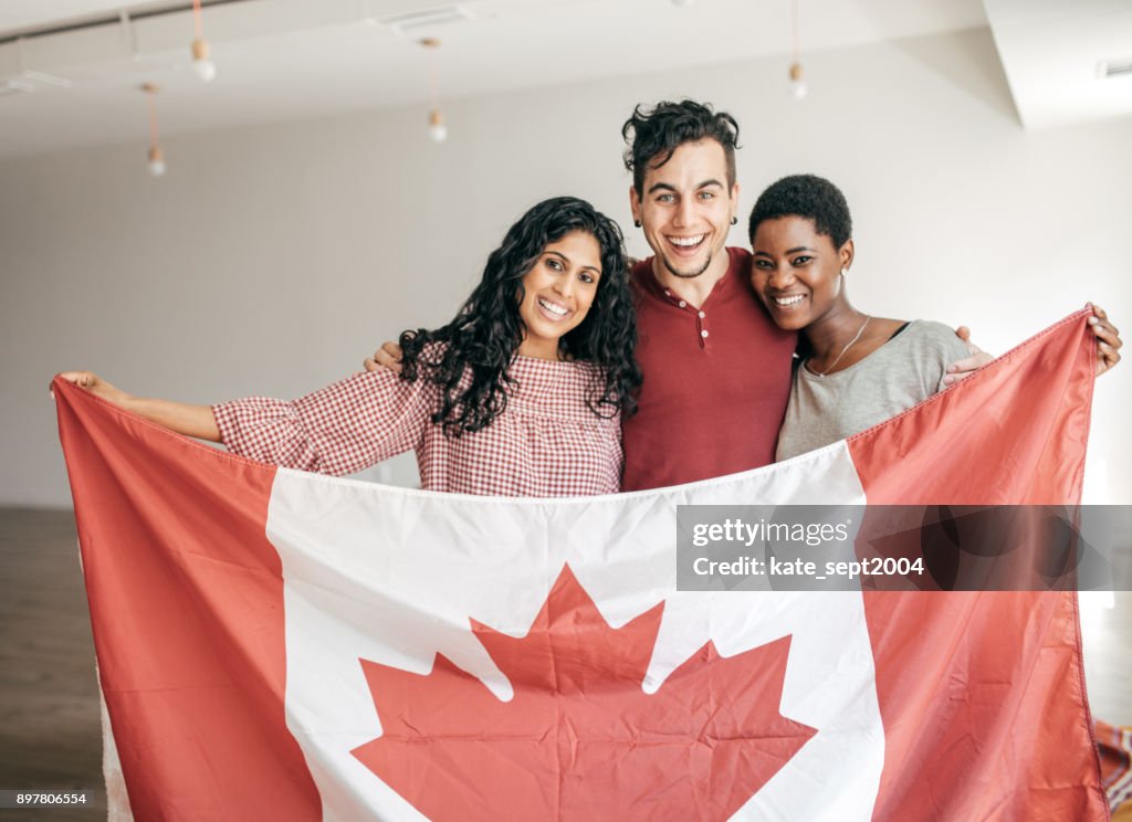 Students holding Canadian flag