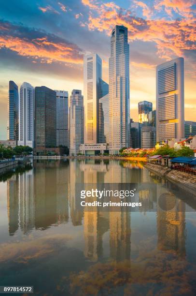 view of the skyline of singapore downtown cbd - merlion park singapore stock pictures, royalty-free photos & images