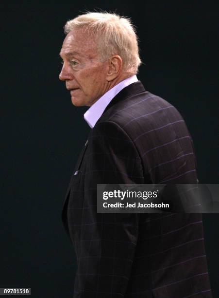 Owner of the Dallas Cowboys Jerry Jones walks on the field against the Oakland Raiders during a preseason game at Oakland-Alameda County Coliseum on...