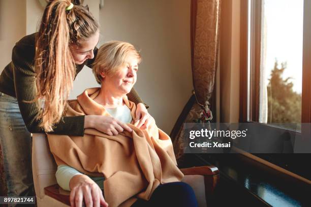elderly care old and young - assistente social imagens e fotografias de stock