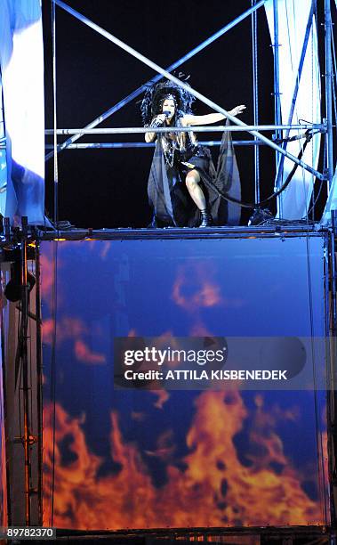 Hungarian singer of the 'La Fura dels Baus' company from Catalonia Eszter Biro performs in the Giant Street Theatre of the Hajogyar Island in...