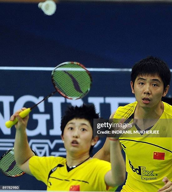 He Hanbin and Yu Yang play a shot against Joachim Fischer Nielsen and Christinna Pedersen of Denmark during their mixed doubles quarter final...