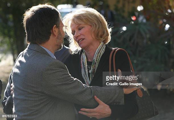 Nina Overton-de Klerk and former Beeld editor Peet Kruger console one another at her late husband Willem de Klerk's memorial service August 13, 2009...