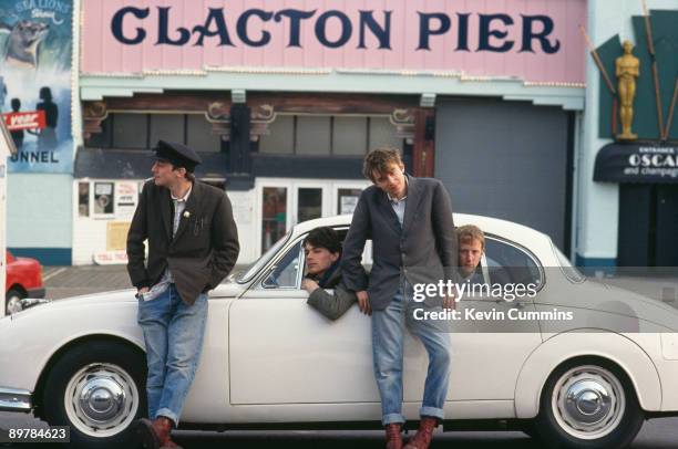 English rock band Blur pose by Clacton Pier in Clacton-on-Sea, Essex, March 1993. Left to right: guitarist Graham Coxon, bassist Alex James, singer...