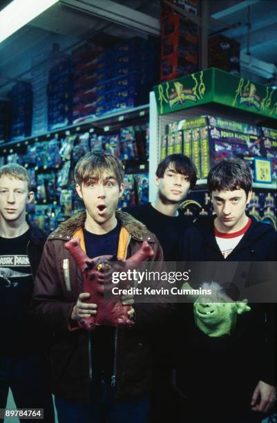 English rock band Blur pose in a toy shop, 15th January 1996. From left to right, drummer Dave Rowntree, singer Damon Albarn, bassist Alex James and...