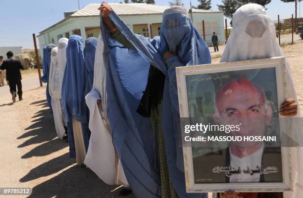 Afghan women welcomes Afghan presidential candidate and former finance minister Ashraf Ghani in Maymana city of the northern province Faryab on...