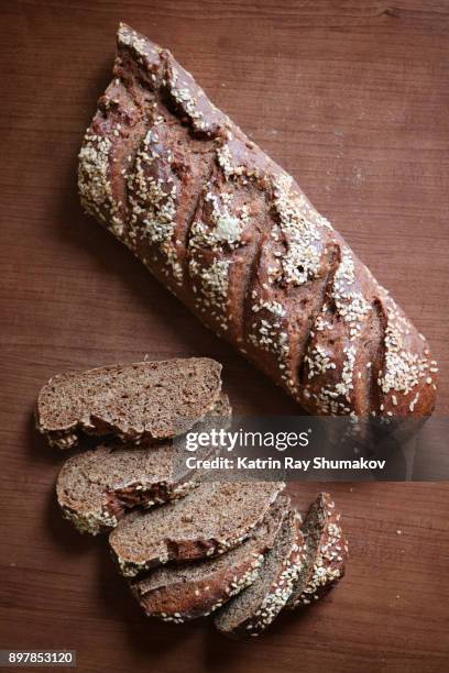 homemade rye baguettes. sliced - roggebrood stockfoto's en -beelden