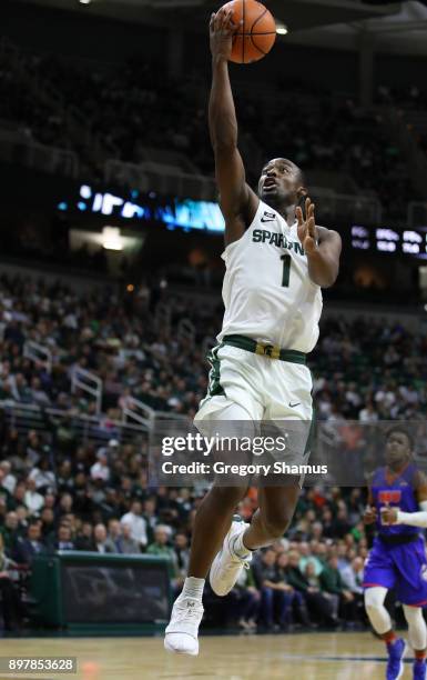 Joshua Langford of the Michigan State Spartans drives to the basket against the Houston Baptist Huskies at the Jack T. Breslin Student Events Center...