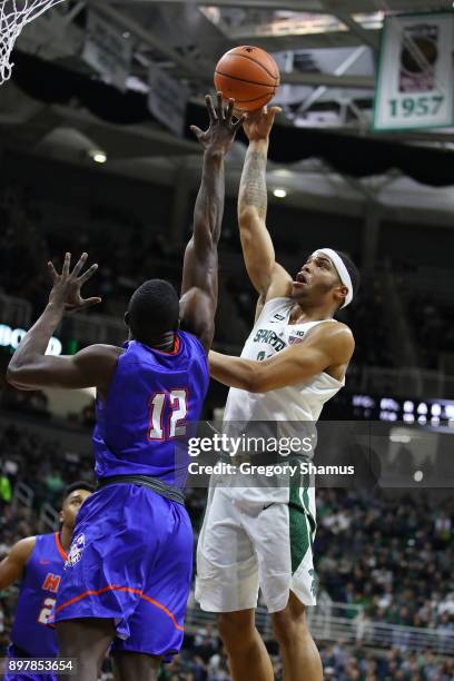 Miles Bridges of the Michigan State Spartans takes a first half shot while playing the Houston Baptist Huskies at the Jack T. Breslin Student Events...
