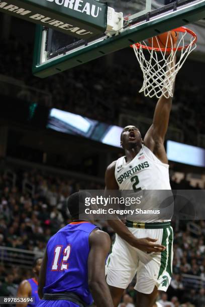 Jaren Jackson Jr. #2 of the Michigan State Spartans dunks over Tim Myles of the Houston Baptist Huskies during the second half at the Jack T. Breslin...