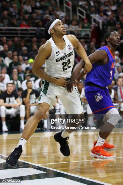 Miles Bridges of the Michigan State Spartans rebounds while playing the Houston Baptist Huskies at the Jack T. Breslin Student Events Center on...