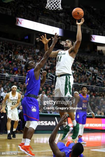 Nick Ward of the Michigan State Spartans takes a shot against the Houston Baptist Huskies at the Jack T. Breslin Student Events Center on December...