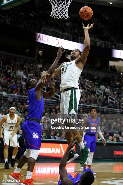 Nick Ward of the Michigan State Spartans takes a shot against the Houston Baptist Huskies at the Jack T. Breslin Student Events Center on December...
