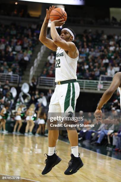 Miles Bridges of the Michigan State Spartans takes a shot while playing the Houston Baptist Huskies at the Jack T. Breslin Student Events Center on...